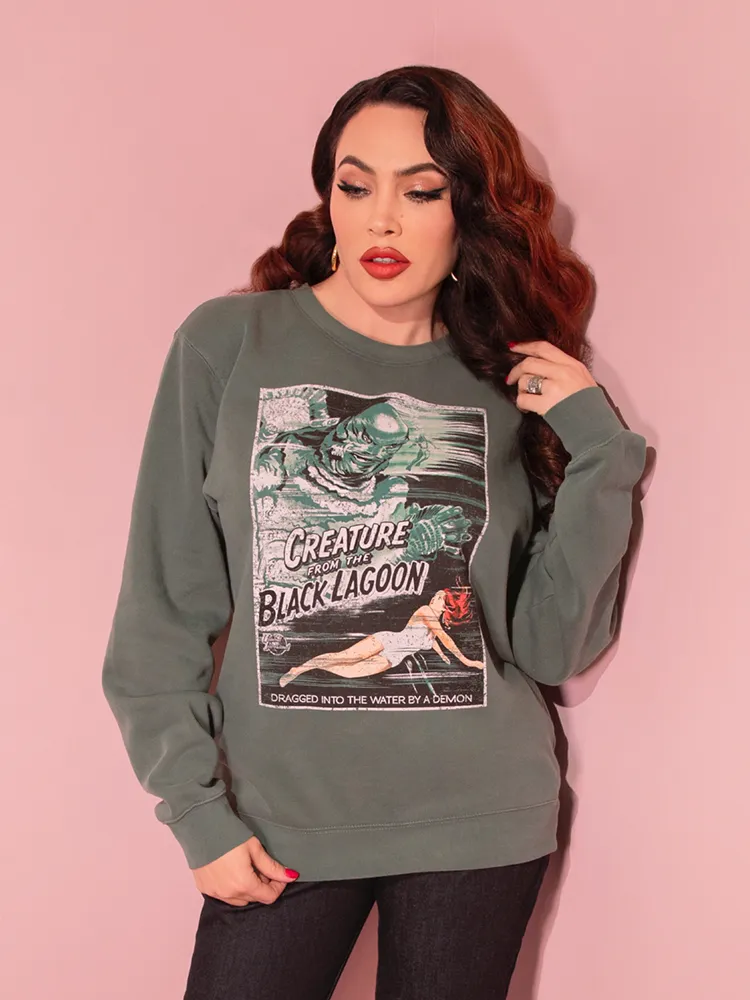 Universal Monsters: Creature from the Black Lagoon Movie Poster Sweatshirt in Vintage Green (unisex)